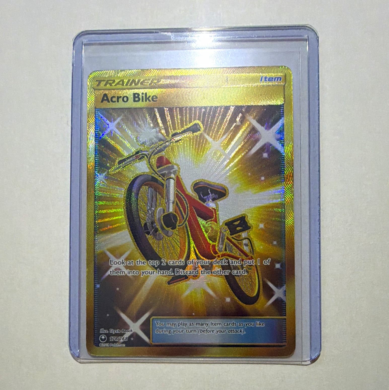The Pokémon Company Acro Bike 178/168 SM Celestial Storm Holo Secret Rare