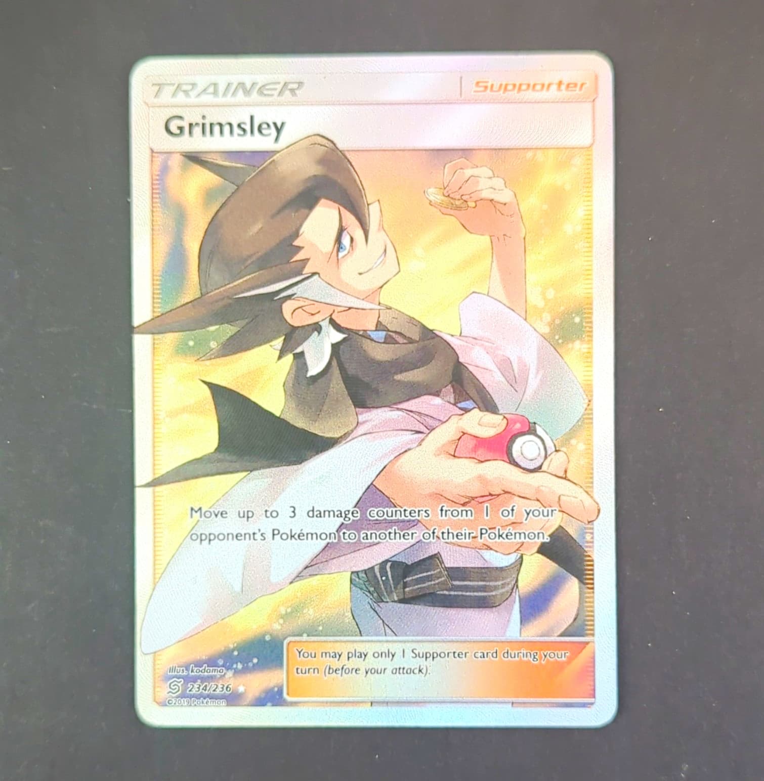 The Pokémon Company Grimsley 234/236 SM-Unified Minds Full Art Holo UR EN