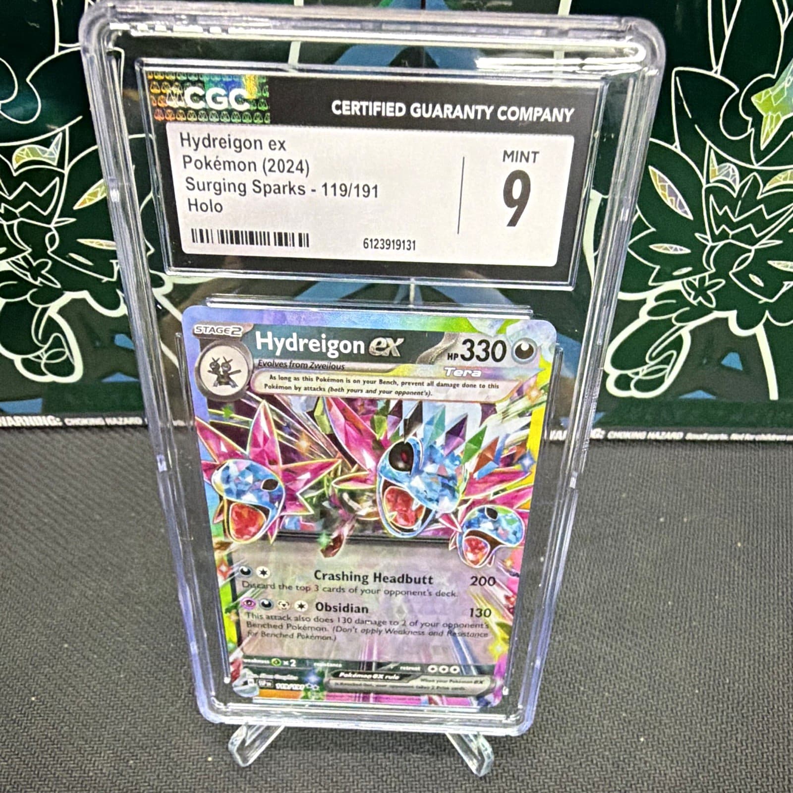 The Pokémon Company 2024 Hydreigon ex 119/191 Surging Sparks Holo CGC 9