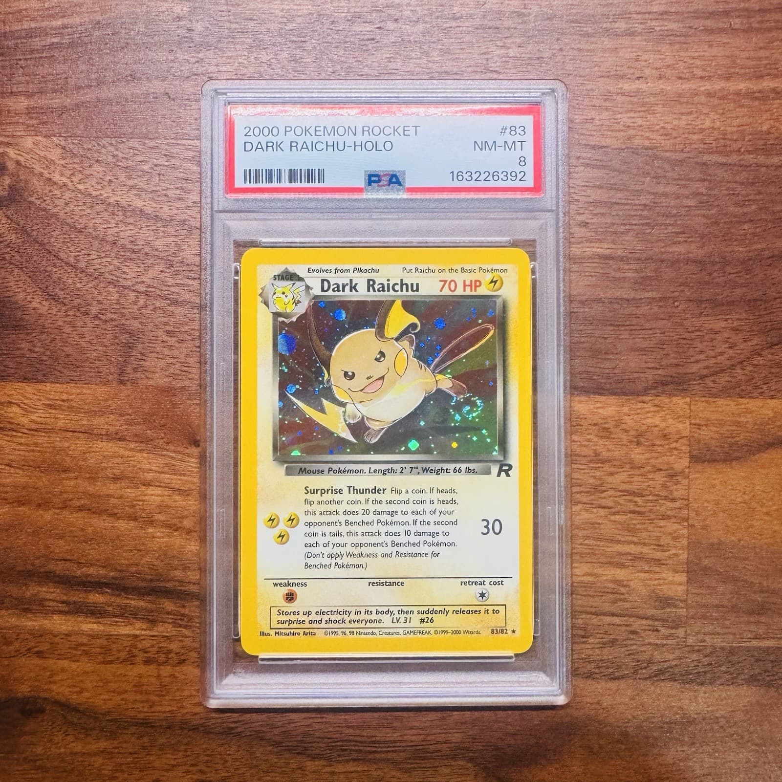 PSA 8 Pokémon Team Rocket Dark Raichu 83/82 Unlimited Holo SWIRL
