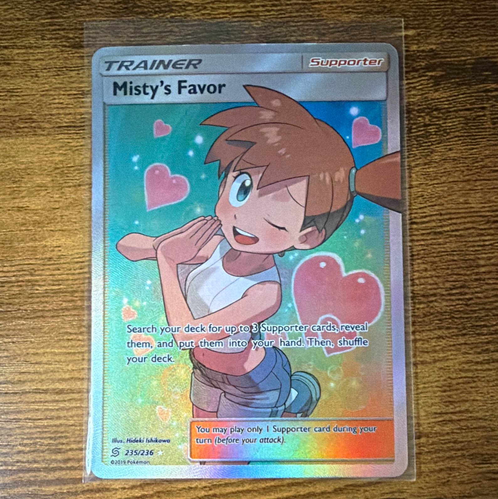The Pokémon Company Misty's Favor 235/236 SM Unified Minds Holo Full Art UR EN