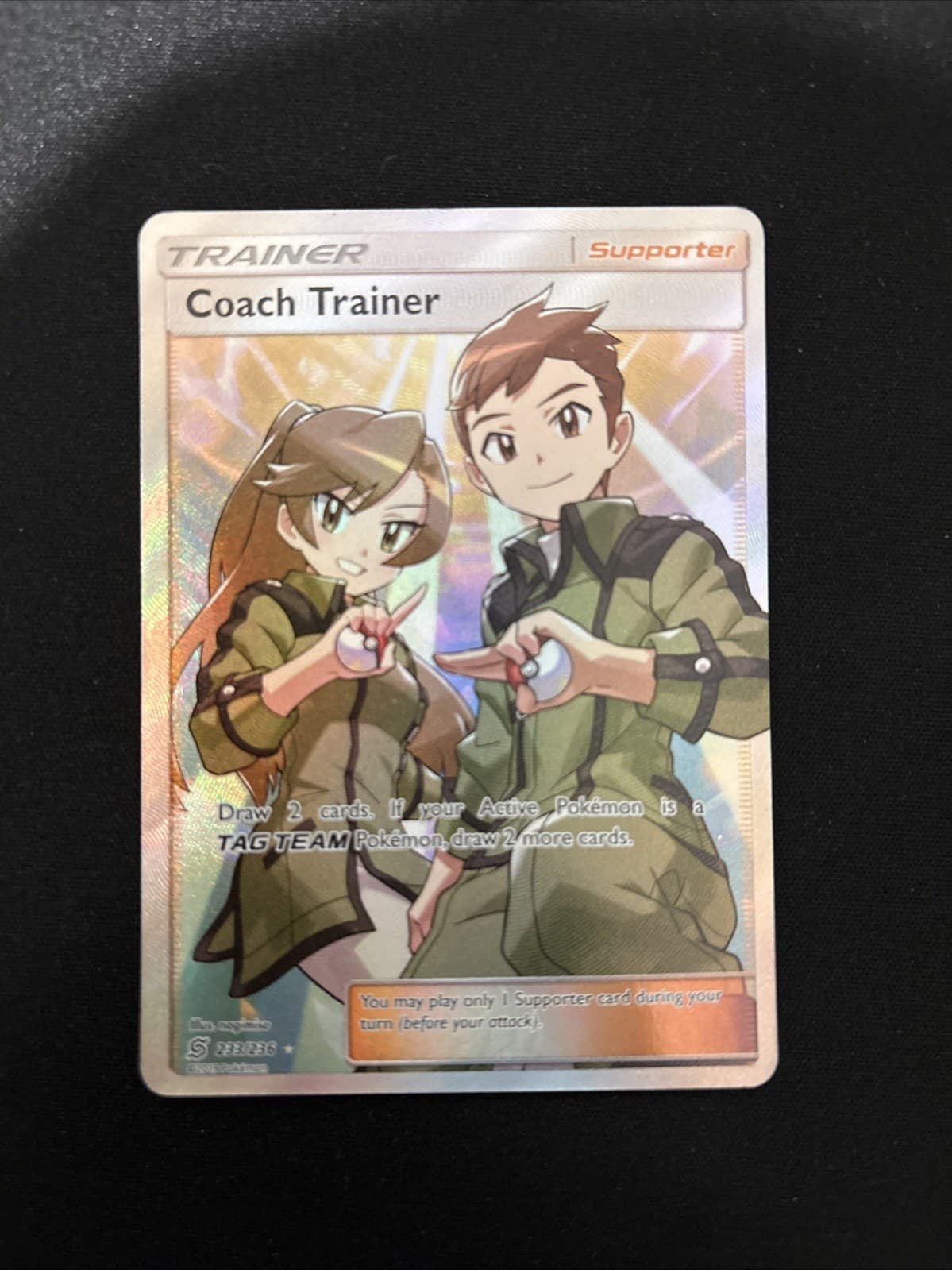 Coach Trainer (Full Art) 233/236 Sm-Unified Minds Holo LP