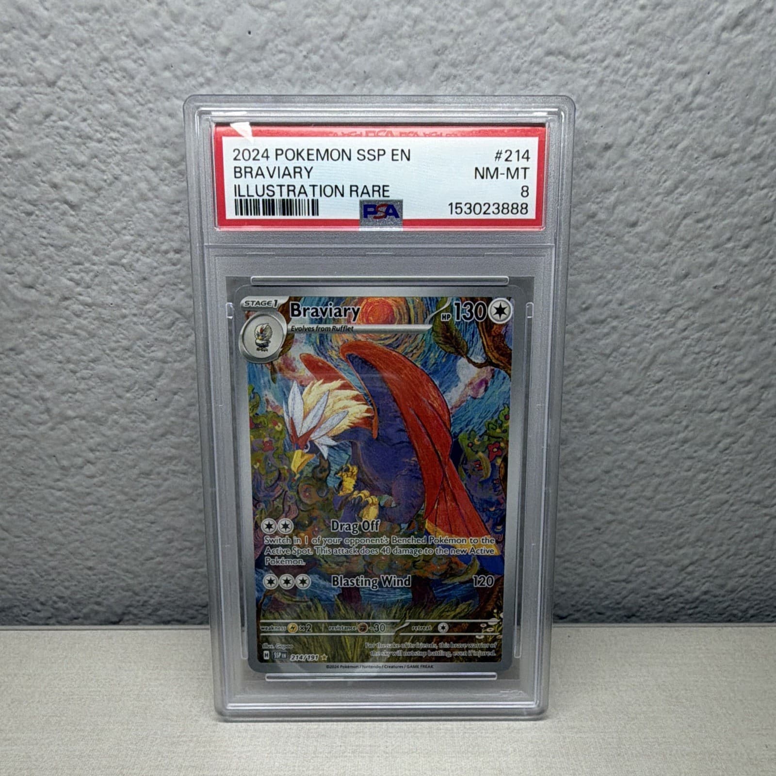 The Pokémon Company Braviary 214/191 Sv08 Surging Sparks Holo PSA 8 IR EN