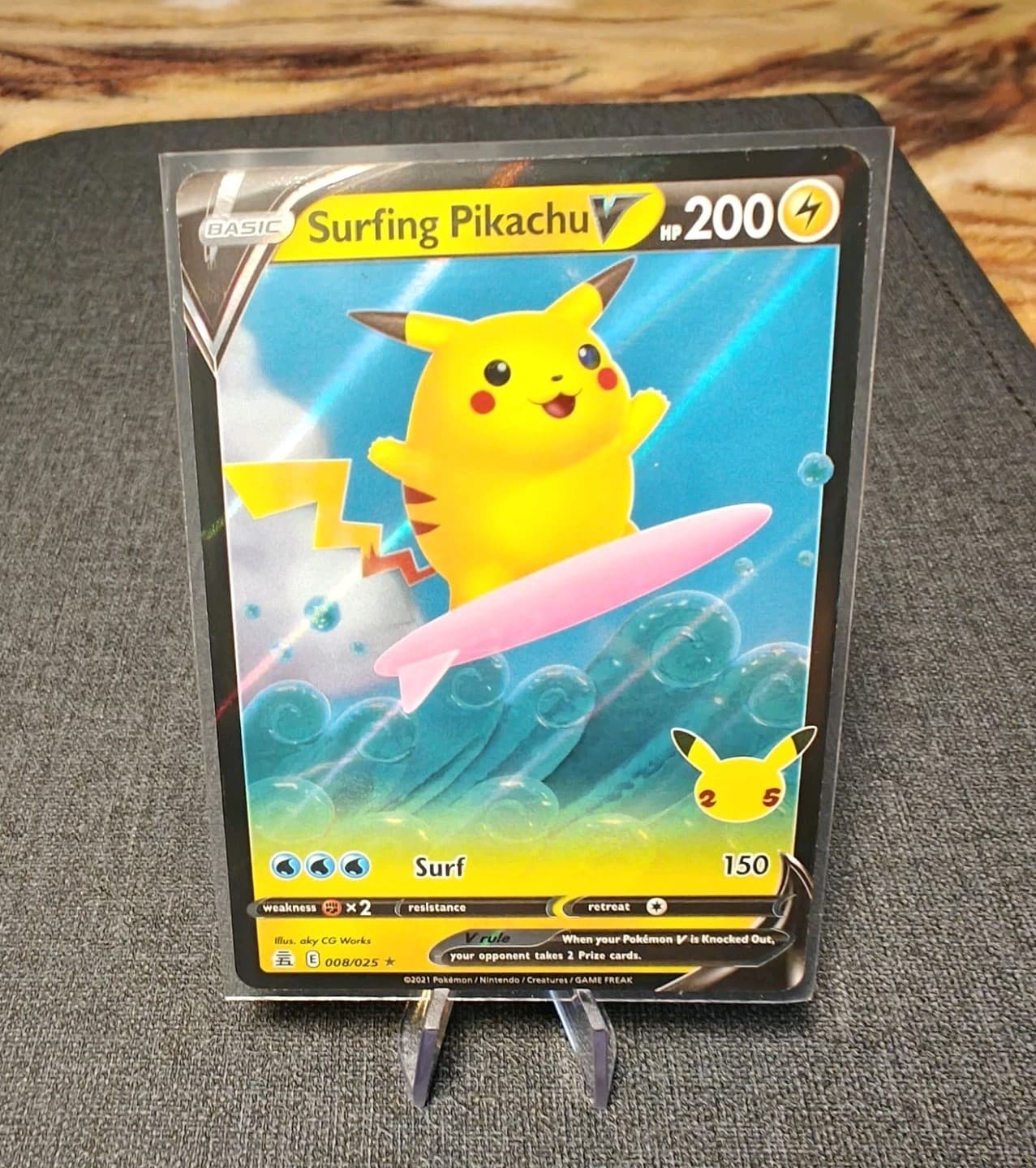 Surfing Pikachu V 8/25 NM Holo #8 Celebrations 25th Anniversary Pokemon Stamp
